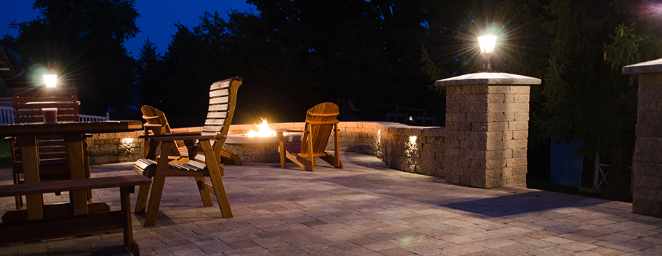 Patio with fireplace at night